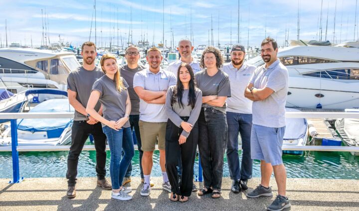 The ARC Marine team standing together in front of a marina as they go about their mission of promoting nature inclusive solutions.